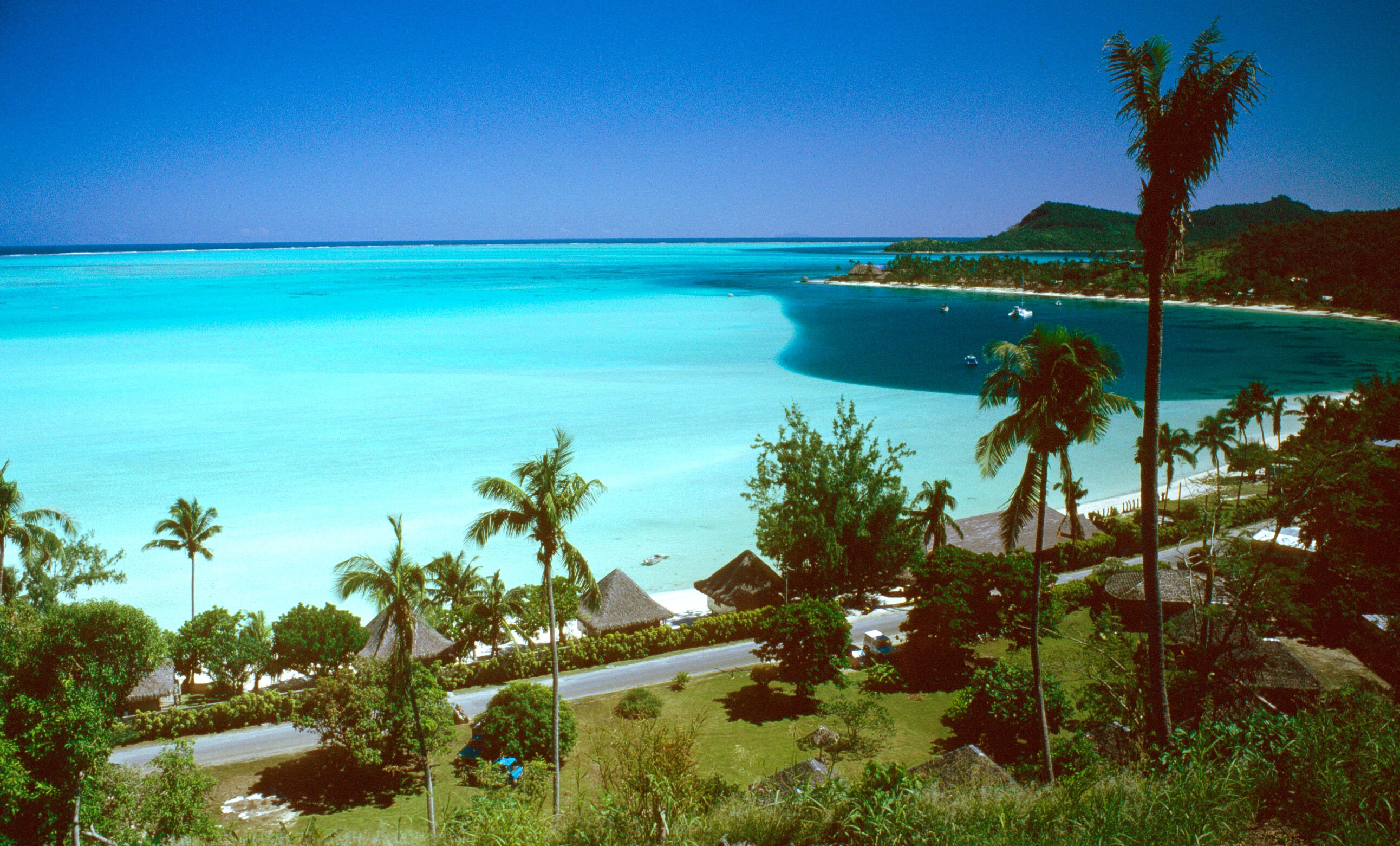 Matira Beach and the turquoise lagoon seen from above on Bora Bora